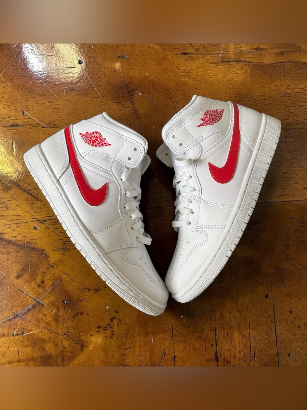 Nike White High-Top Sneakers with Red Swoosh